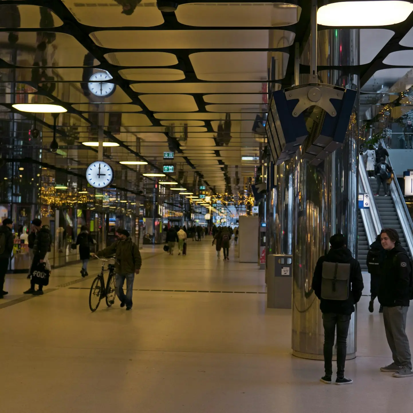 a group of people standing around a train station
