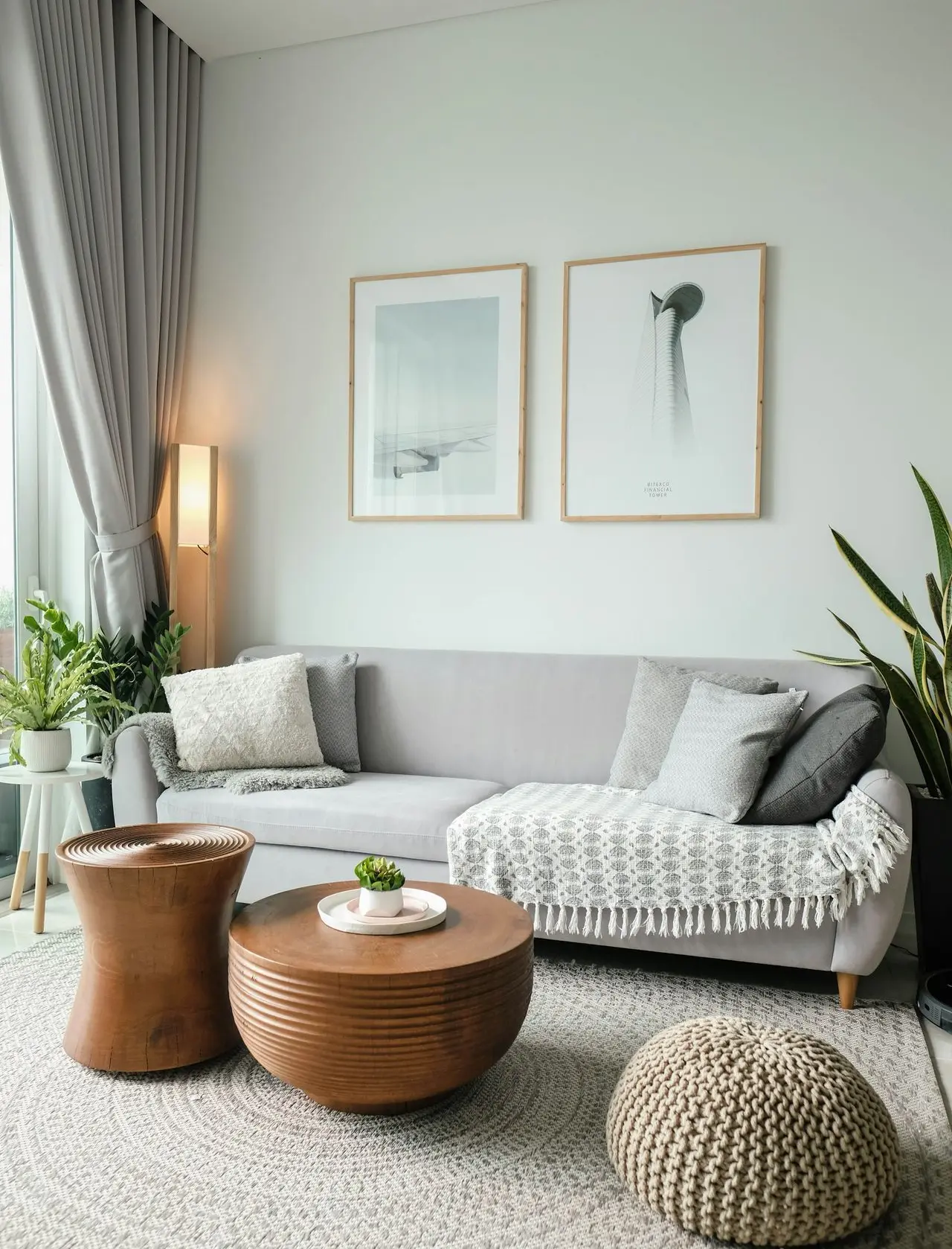 a living room filled with furniture and a large window