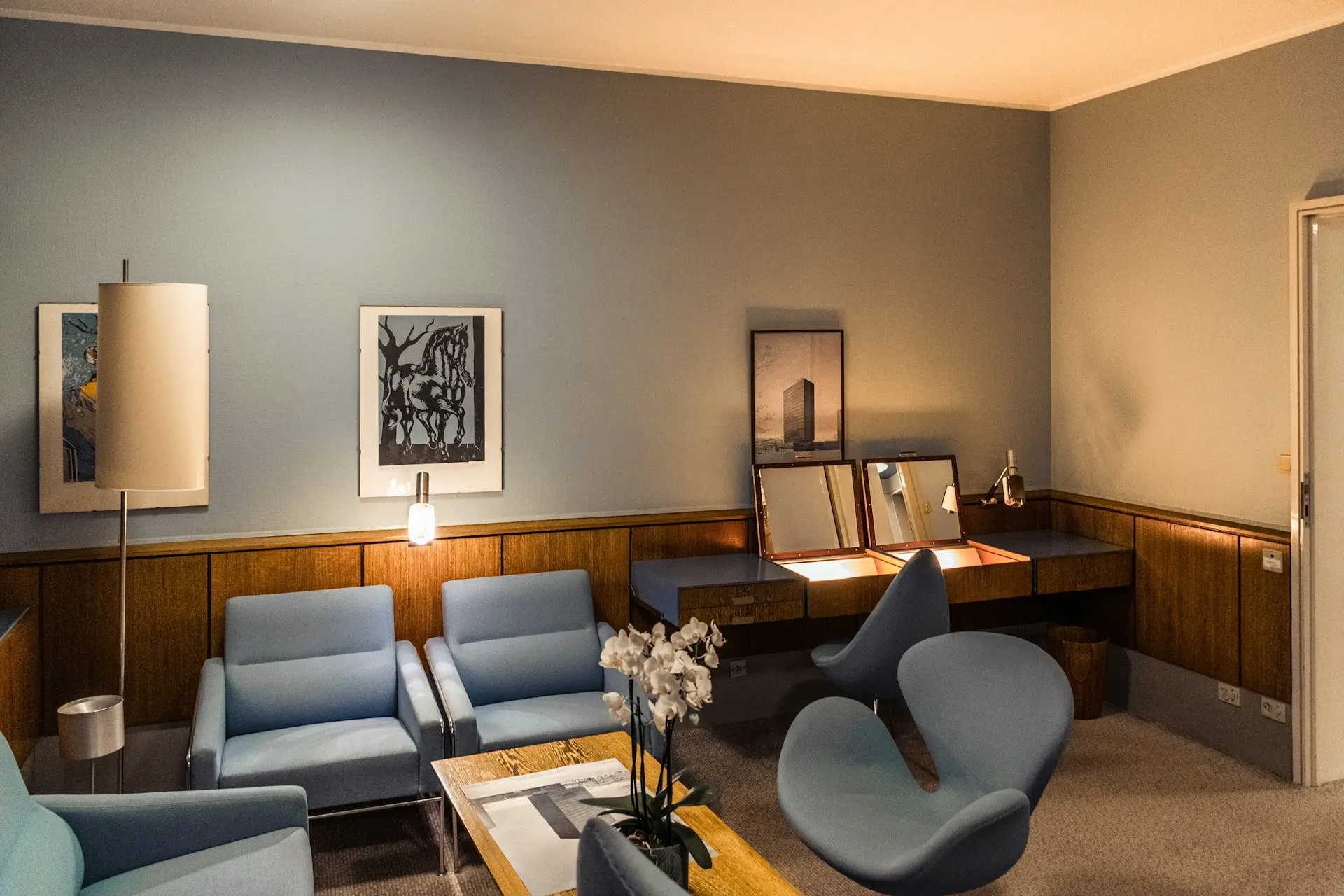 An office waiting room features stylish, retro decor.
